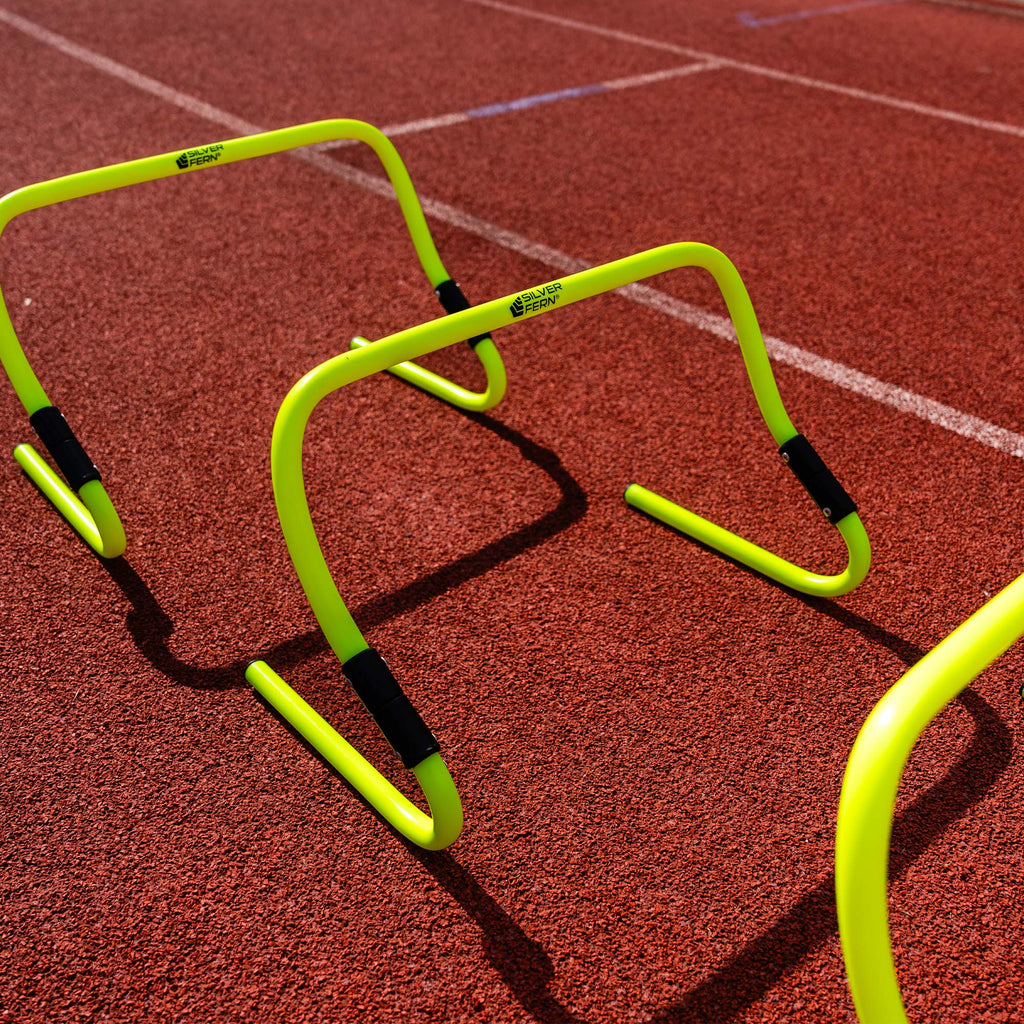 A set of Adjustable Agility Hurdles, placed on an Athletics track.