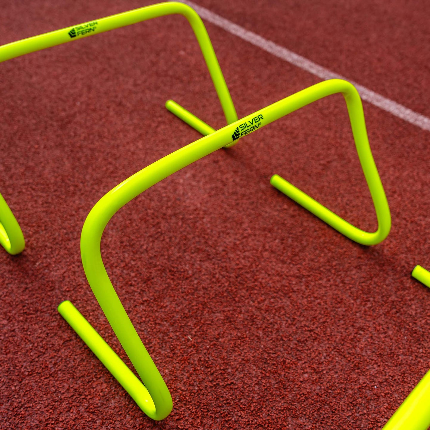 A set of 30 cm Agility Hurdles, lifestyle shot.