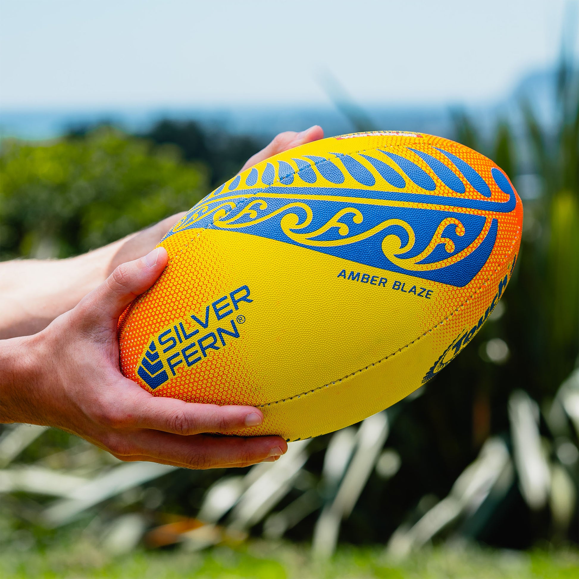 Amber Blaze Yellow and Orange Touch Rugby Ball Lifestyle Image