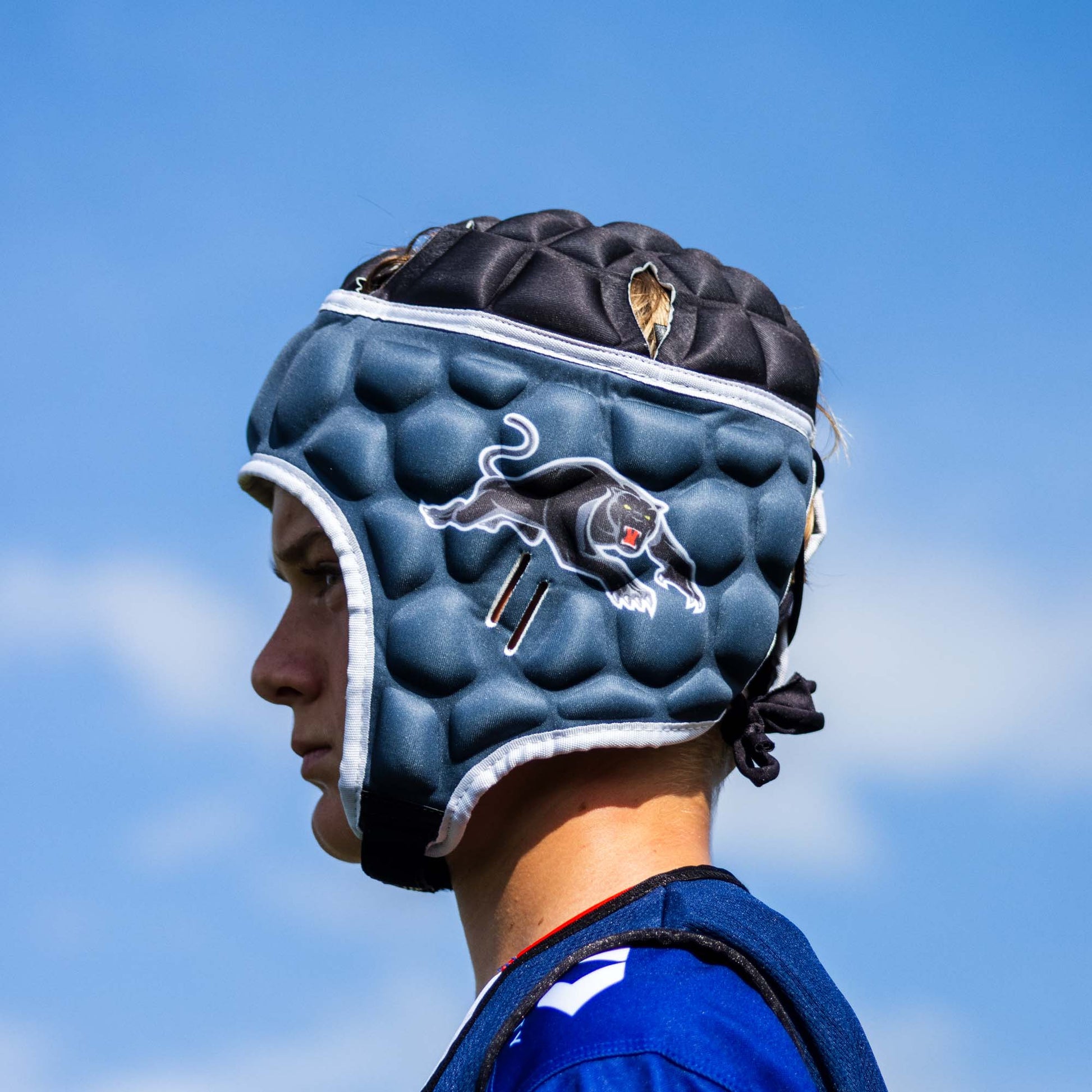 Official NRL Headgear, Penrith Panthers, lifestyle image, side.