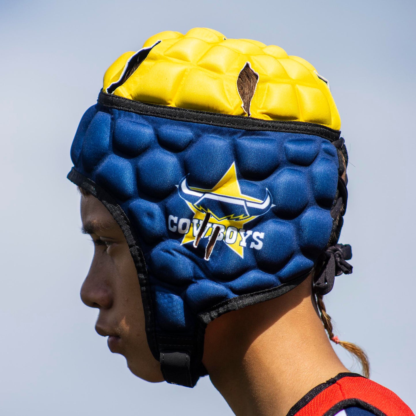 Official NRL Headgear, North Queensland Cowboys, lifestyle image, side.