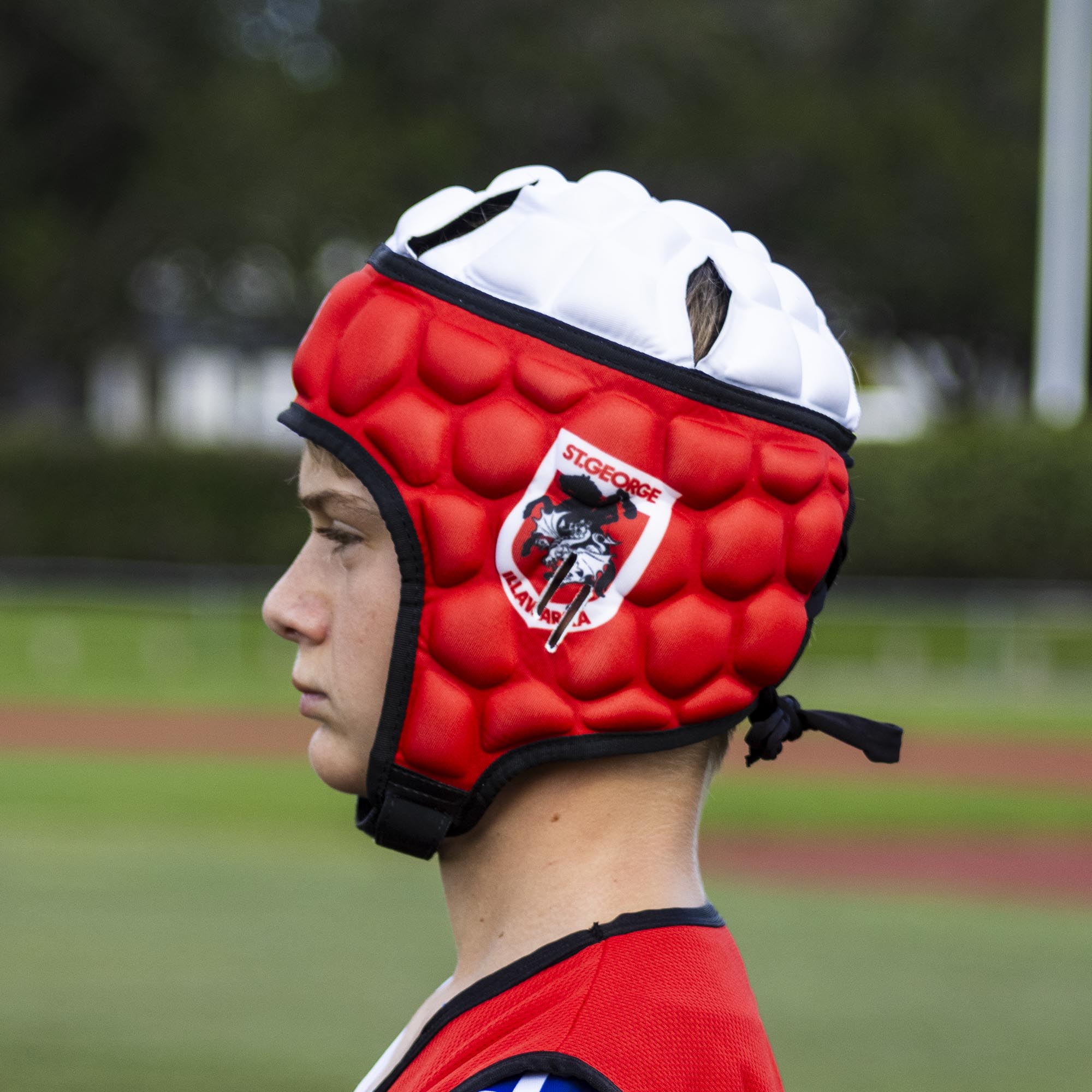 Official NRL Headgear, St. George Illawarra Dragons, lifestyle image, side.