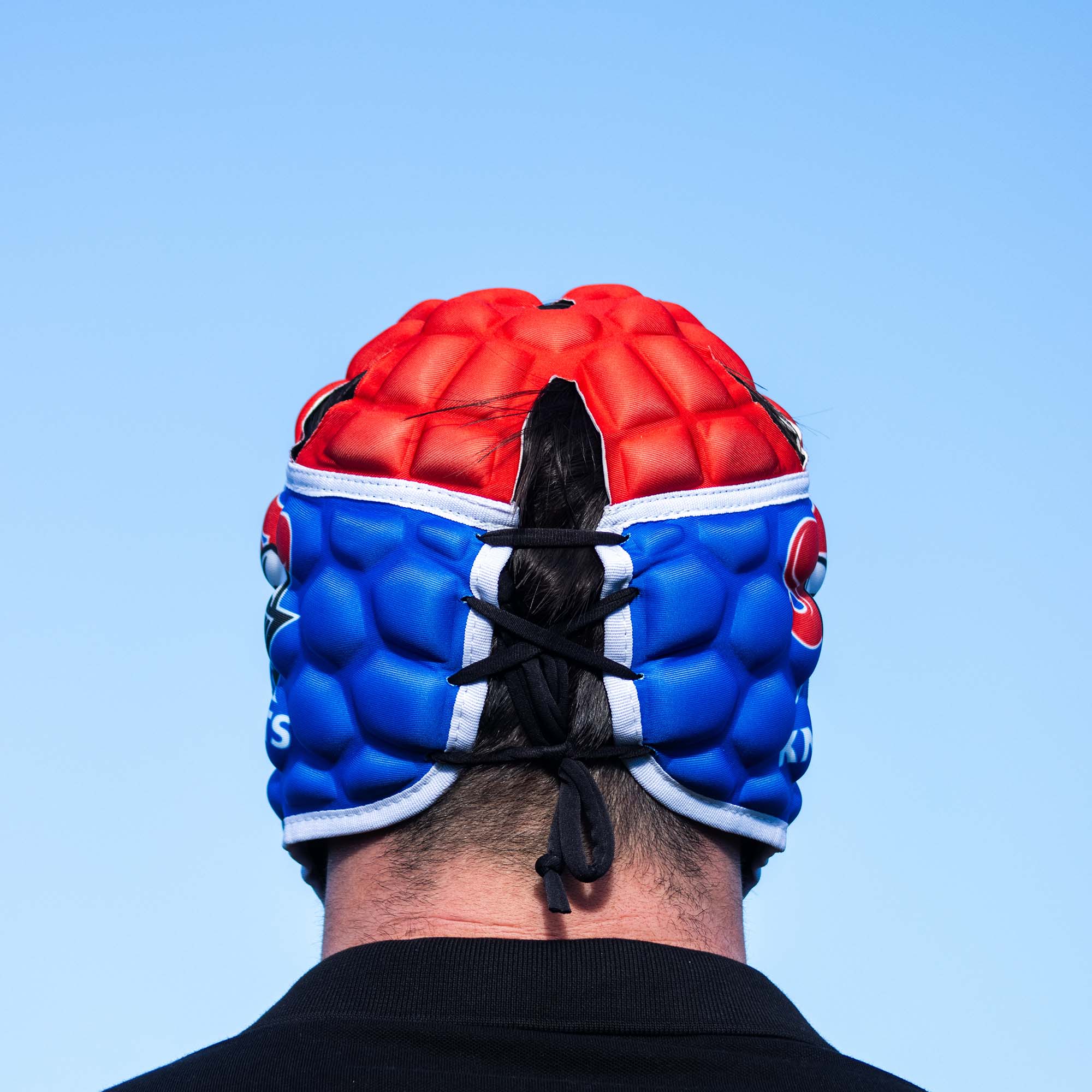 Official NRL Headgear, Newcastle Knights, lifestyle image, back.