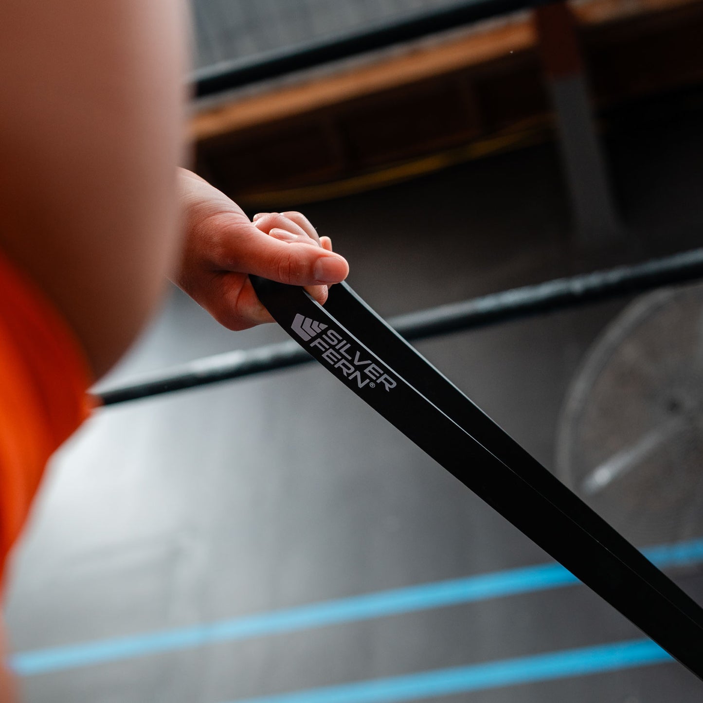 Silver Fern Black Resistance Bands Heavy 22 mm thick. Being used in a fitness exercise.