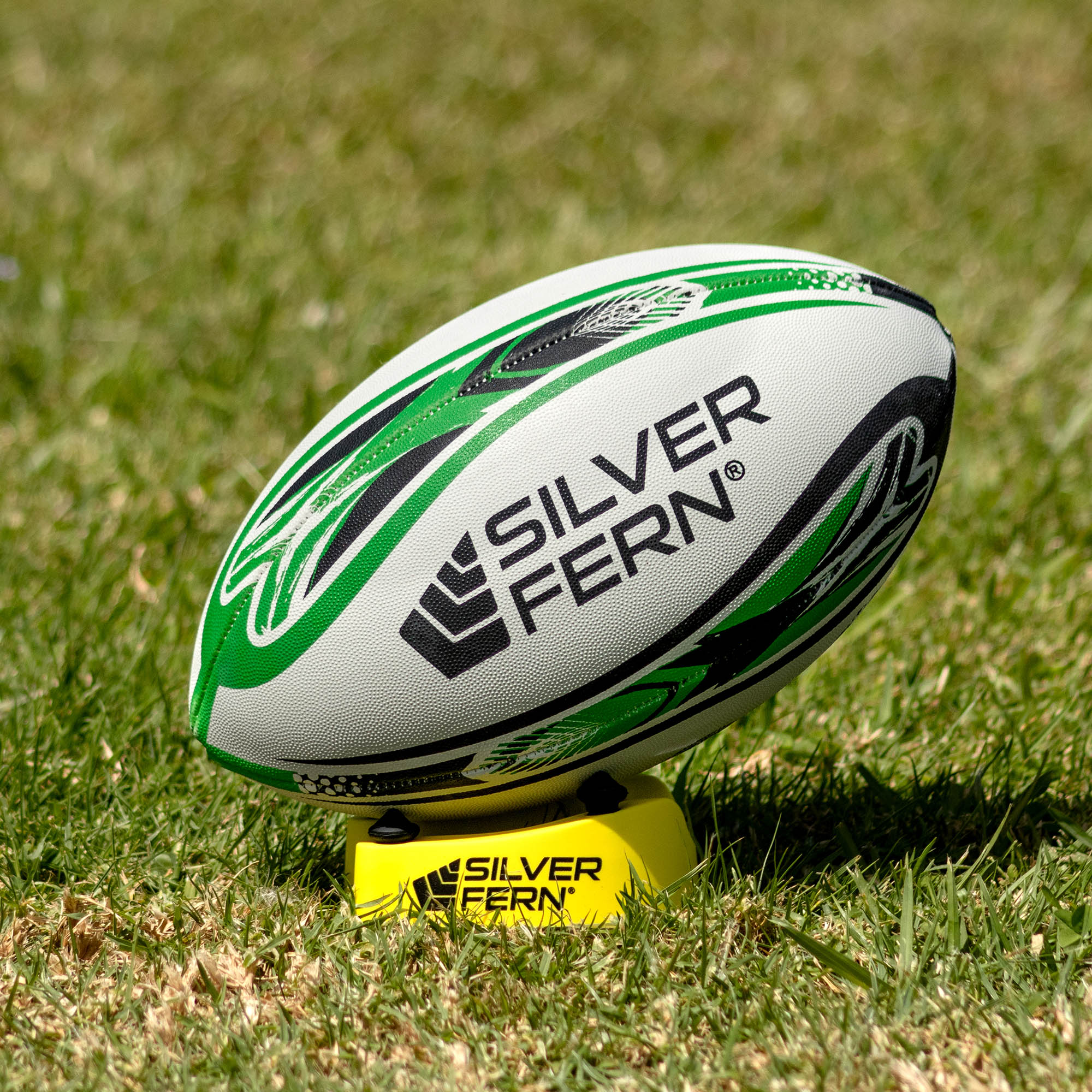 Silver Fern League Mod Trainer Size 4, Lifestyle shot, sitting on a kicking tee

