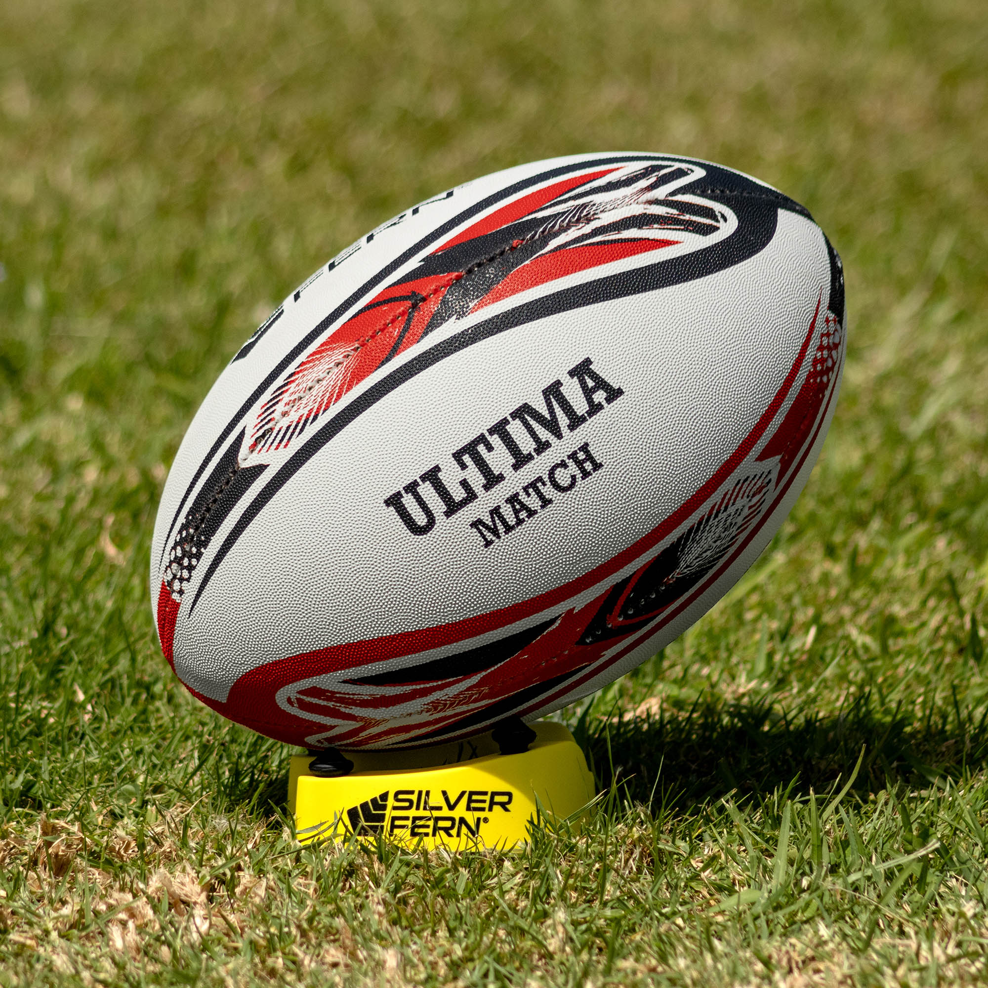 Silver Fern League Ultima Premium Trainer Size 5, Lifestyle shot, sitting on a kicking tee

