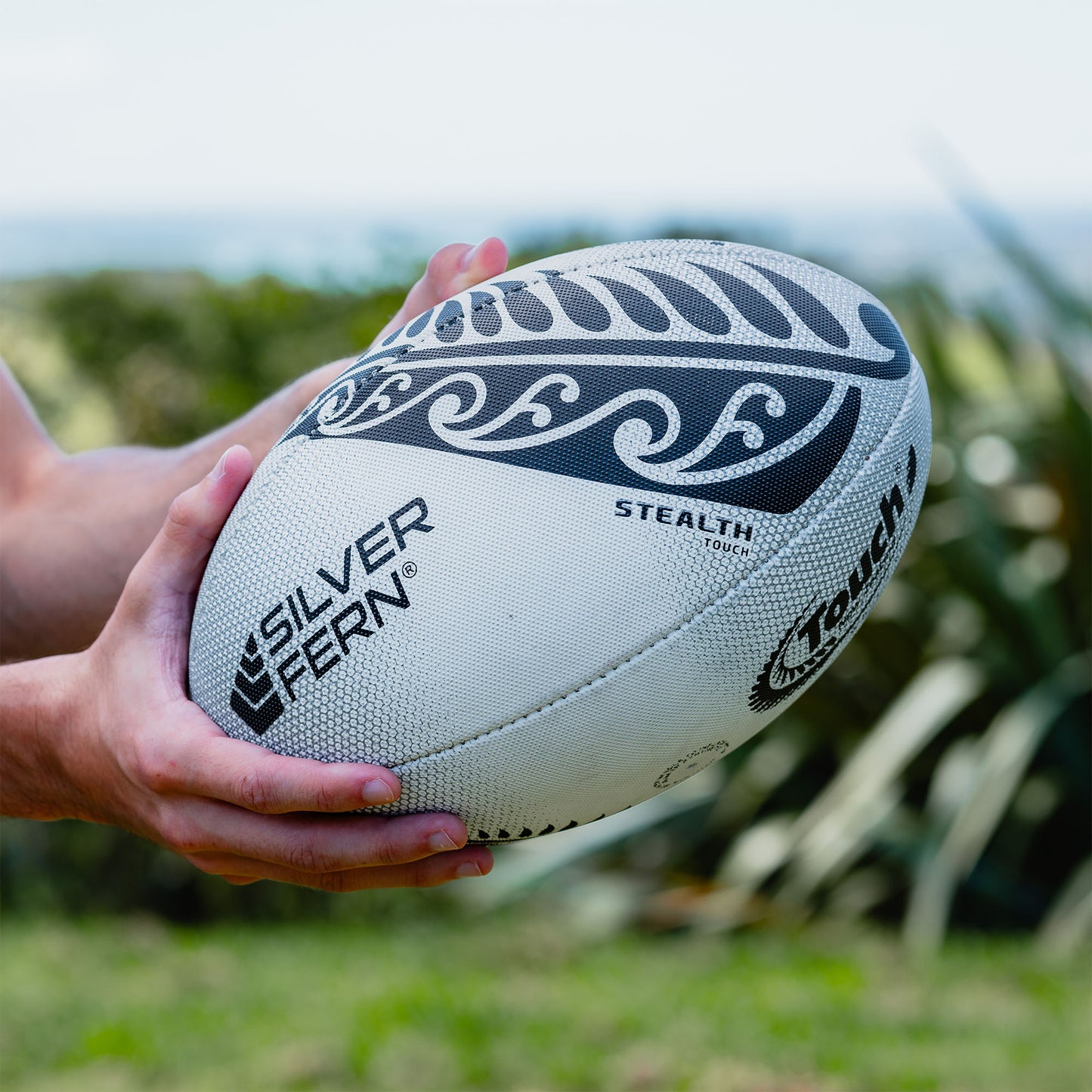 White and Black Stealth Match Touch Rugby Ball Lifestyle Image