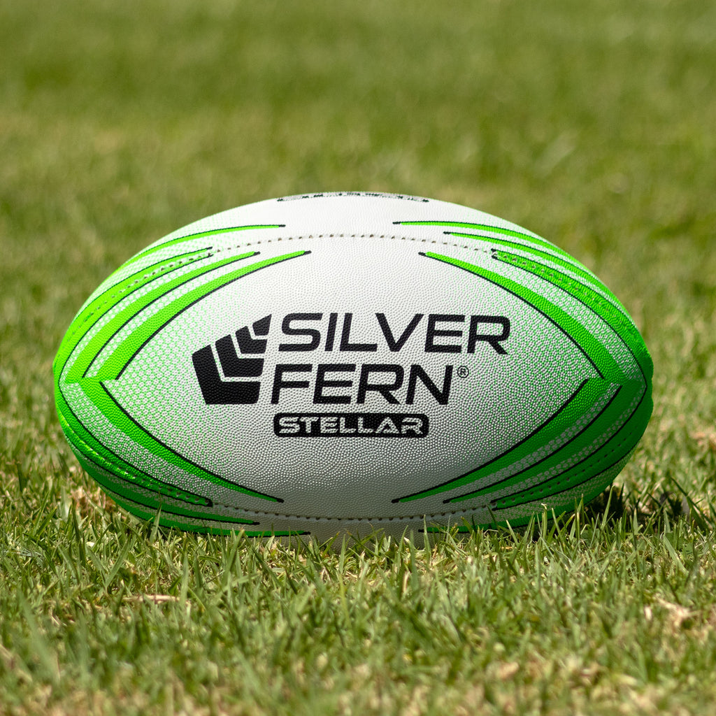 Silver Fern Stellar Premium Trainer Size 4, Lifestyle shot, sitting on a rugby field