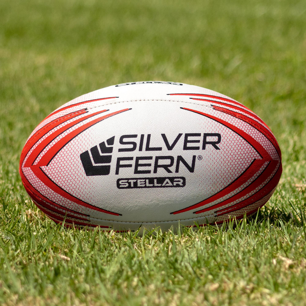 Silver Fern Stellar Premium Trainer Size 5, Lifestyle shot, sitting on a rugby field