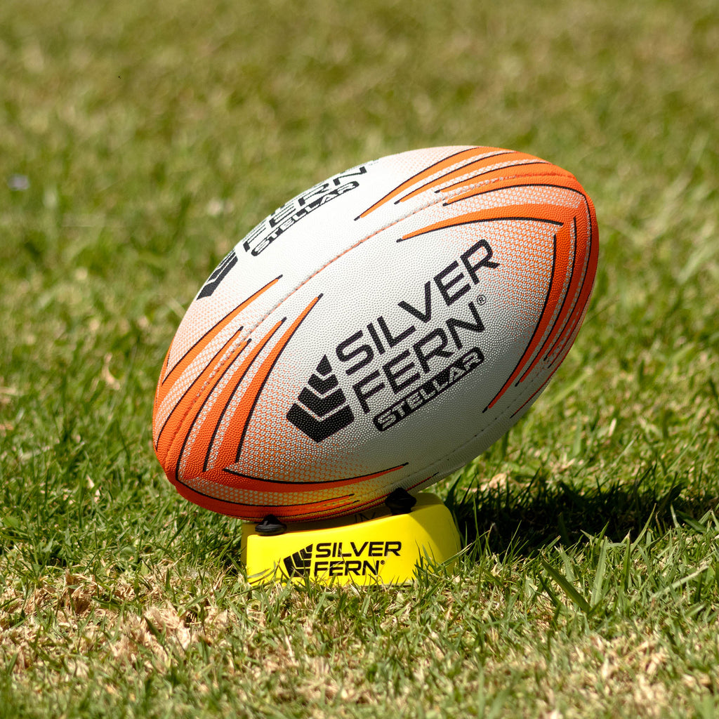 Silver Fern Stellar Premium Trainer Size 2.5, Lifestyle shot, sitting on a kicking tee