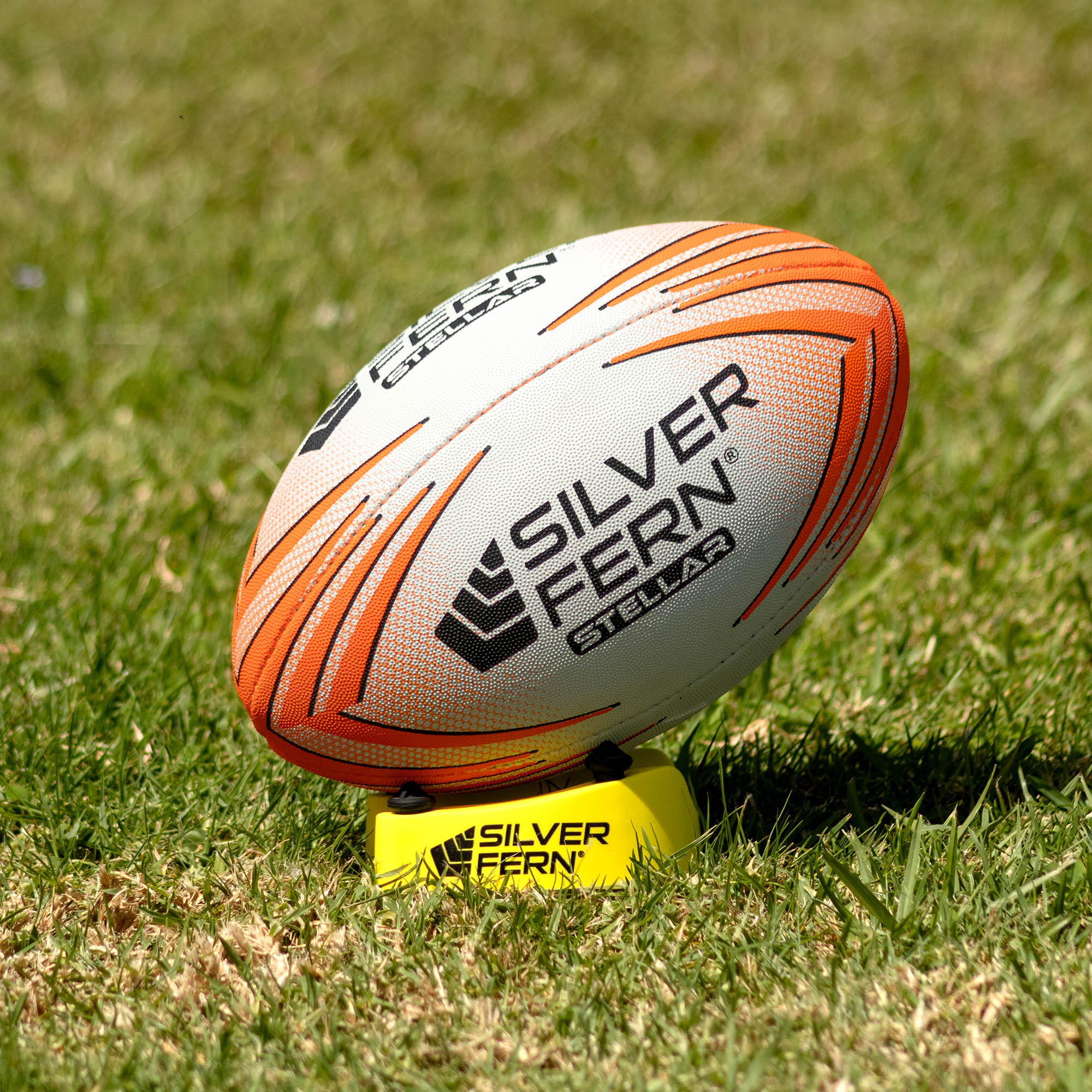 Silver Fern Stellar Premium Trainer Size 2.5, Lifestyle shot, sitting on a kicking tee