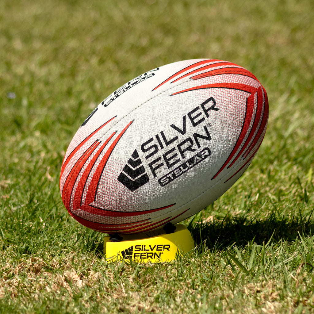 Silver Fern Stellar Premium Trainer Size 5, Lifestyle shot, sitting on a kicking tee
