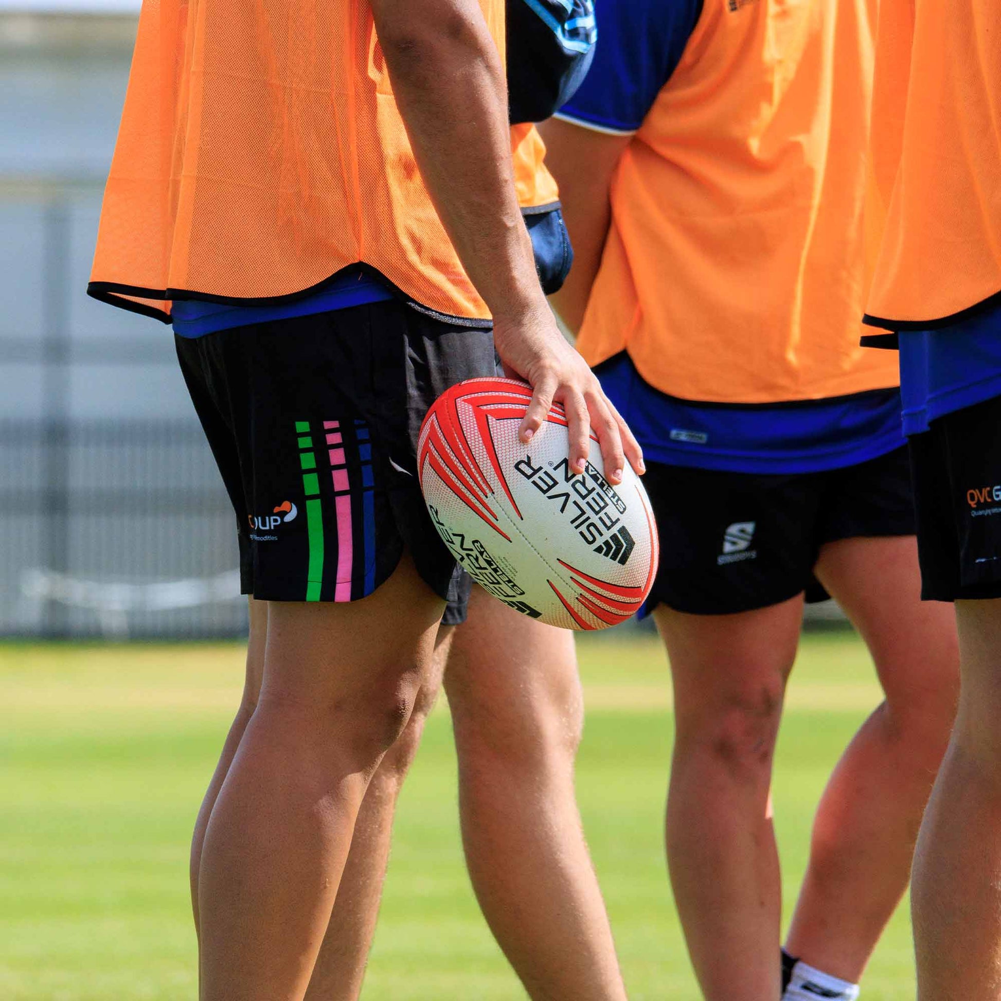 Silver Fern Rugby Premium Trainer Stellar Ball, Red, Size 5, player holding ball, lifestyle.