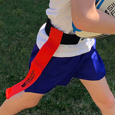 Close up of kid wearing a belt and flag set for Tag Rugby / Rippa Rugby.